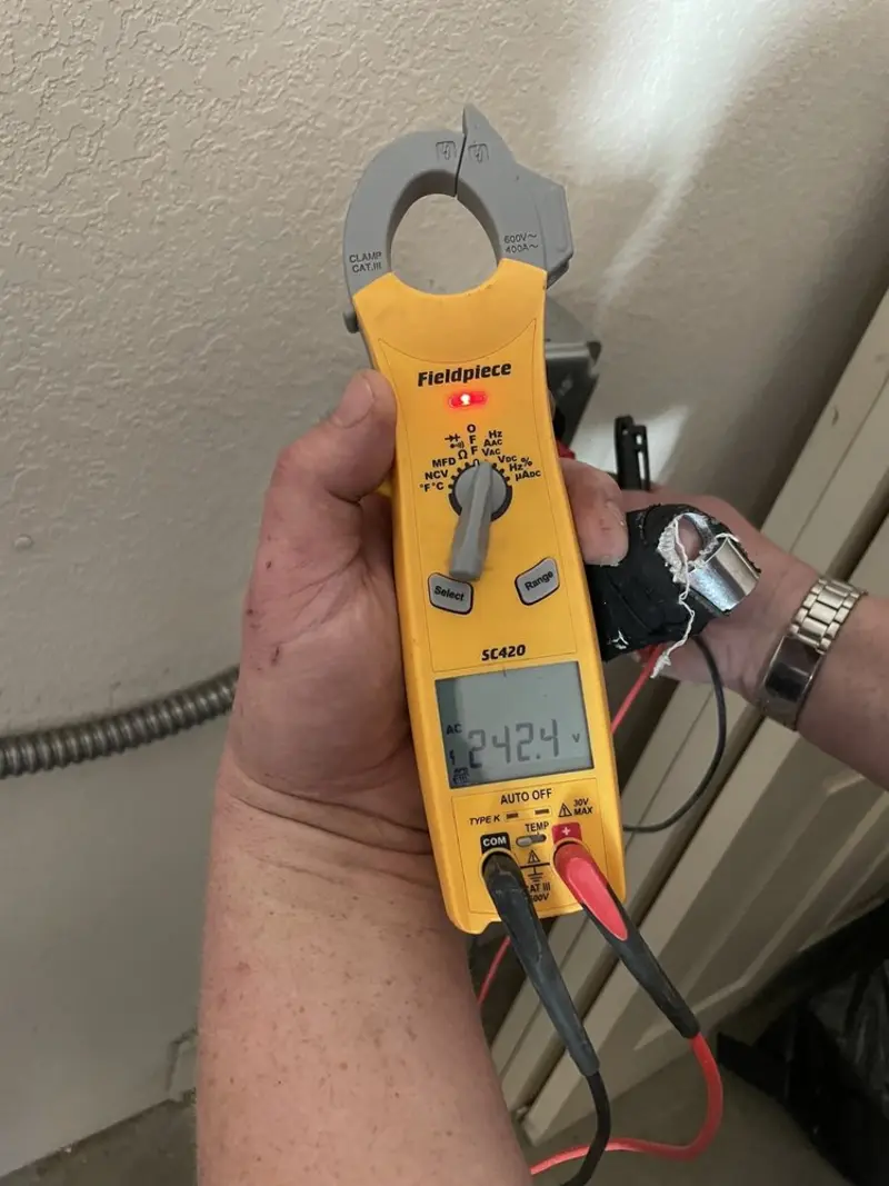 Voltage testing with clamp meter during Outlet Installation in Scotia